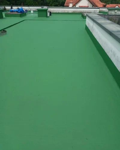Waterproofing contractor applying protective membrane before tile installation