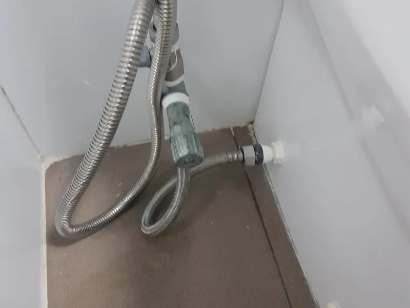 Licensed plumber installing water supply pipes during renovation project